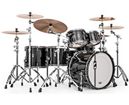 A black drum set with multiple cymbals and drums on a white background.